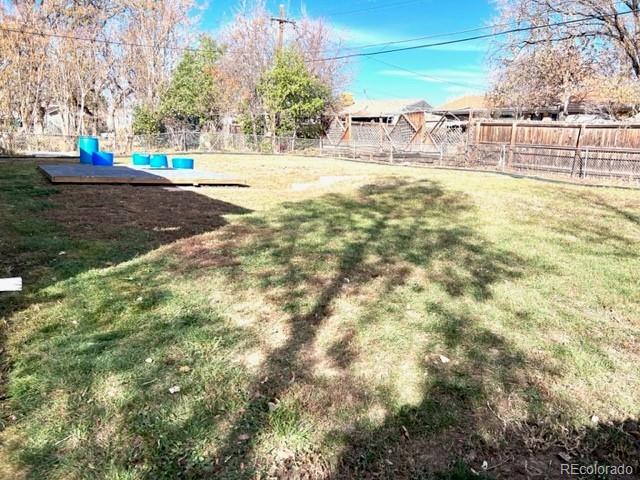 8640 Cherry Lane Westminster, CO 80031 - Photo 11 of 11 a view of a yard with a trees