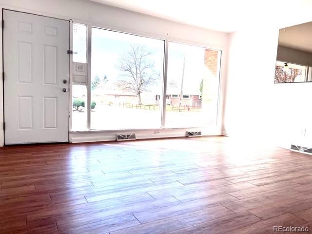 8640 Cherry Lane Westminster, CO 80031 - Photo 2 of 11 a view of a room with wooden floor and window