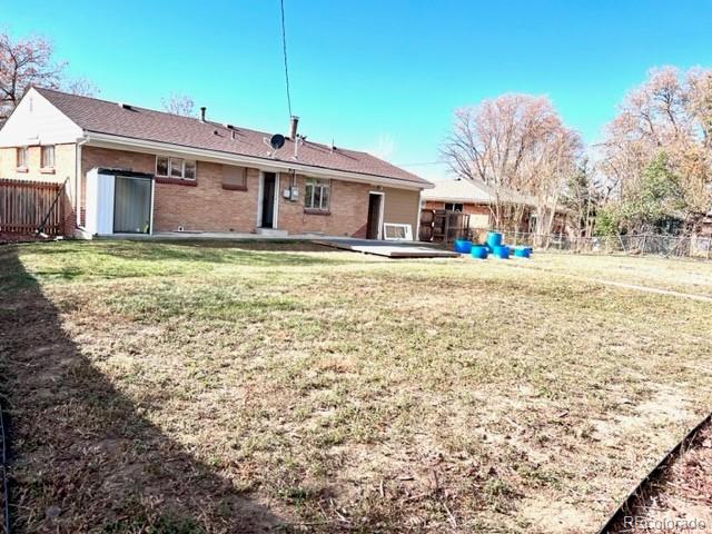 8640 Cherry Lane Westminster, CO 80031 - Photo 10 of 11 a front view of a house with a yard