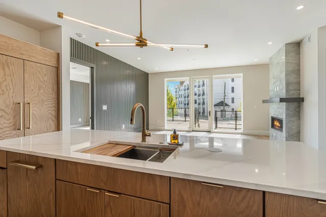 a kitchen with a sink and a large window