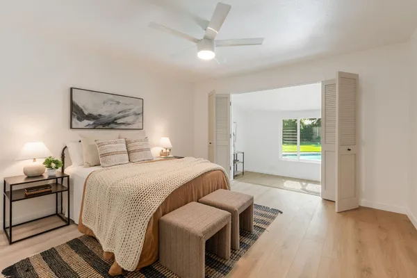 a bedroom with a bed and a couch