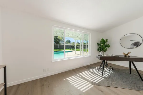 a view of a room with a window and sitting area