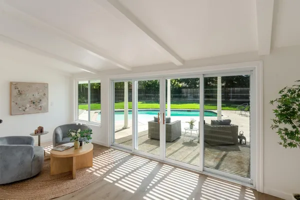 a living room with furniture and a potted plant