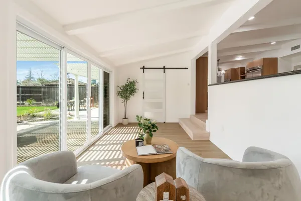 a living room with furniture and a large window