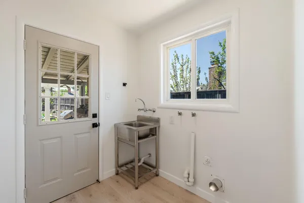 a room that has a window and a chair in it