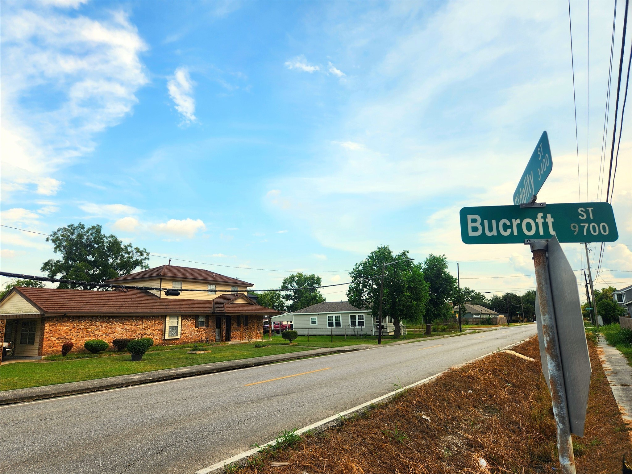 9720 Bucroft Street Houston, TX 77029 - Photo 7 of 12 a street sign is sitting on the side of a road