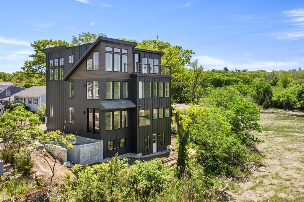 10 Chestnut Place Hingham, MA 02043 - Photo 1 of 41 a front view of a house with a yard