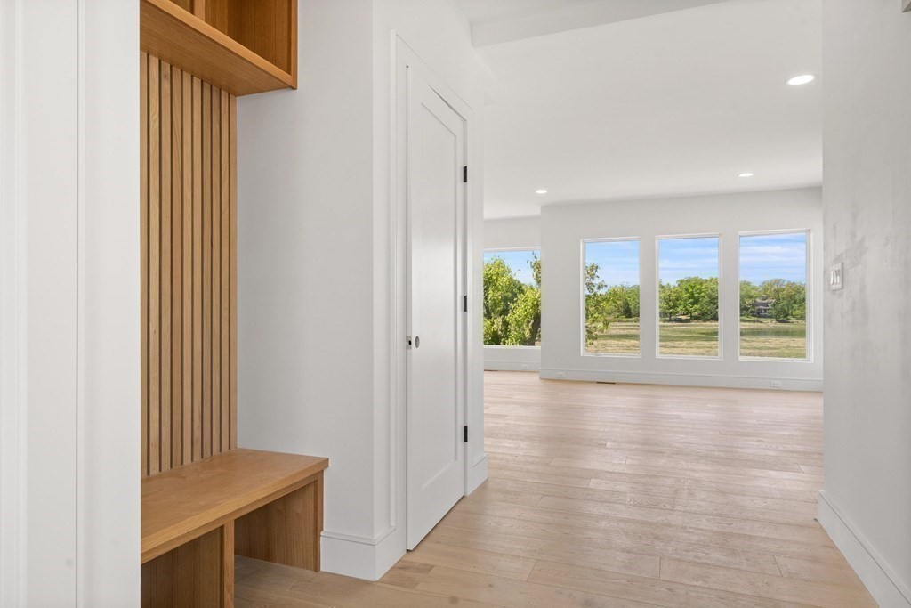 10 Chestnut Place Hingham, MA 02043 - Photo 11 of 41 a view of hallway with window and wooden floor