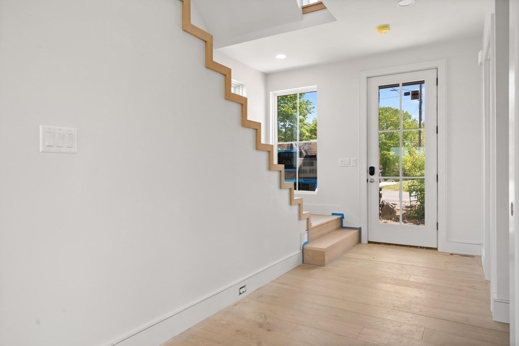 10 Chestnut Place Hingham, MA 02043 - Photo 13 of 41 wooden floor in an empty room with a window