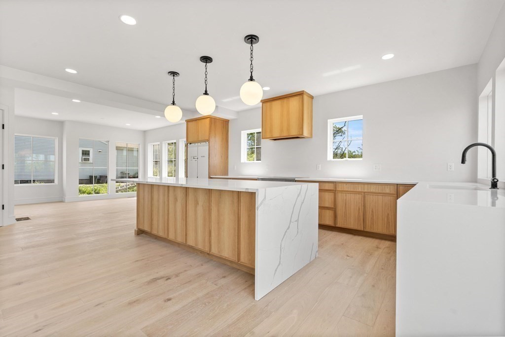 10 Chestnut Place Hingham, MA 02043 - Photo 14 of 41 a kitchen with kitchen island a sink and a stove