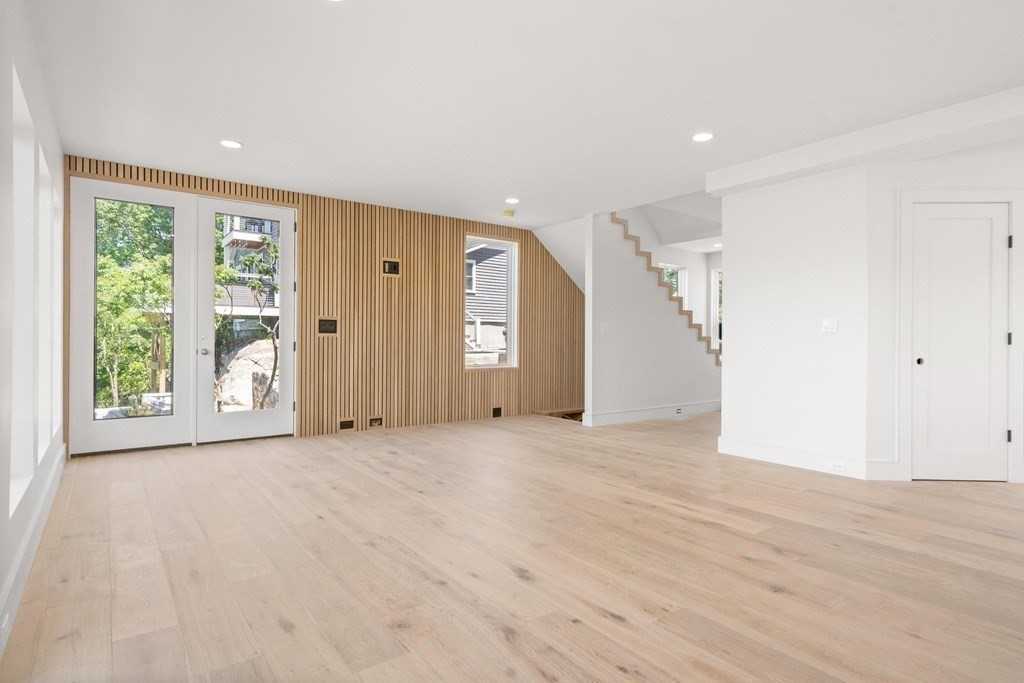 10 Chestnut Place Hingham, MA 02043 - Photo 16 of 41 a view of an empty room with wooden floor and windows