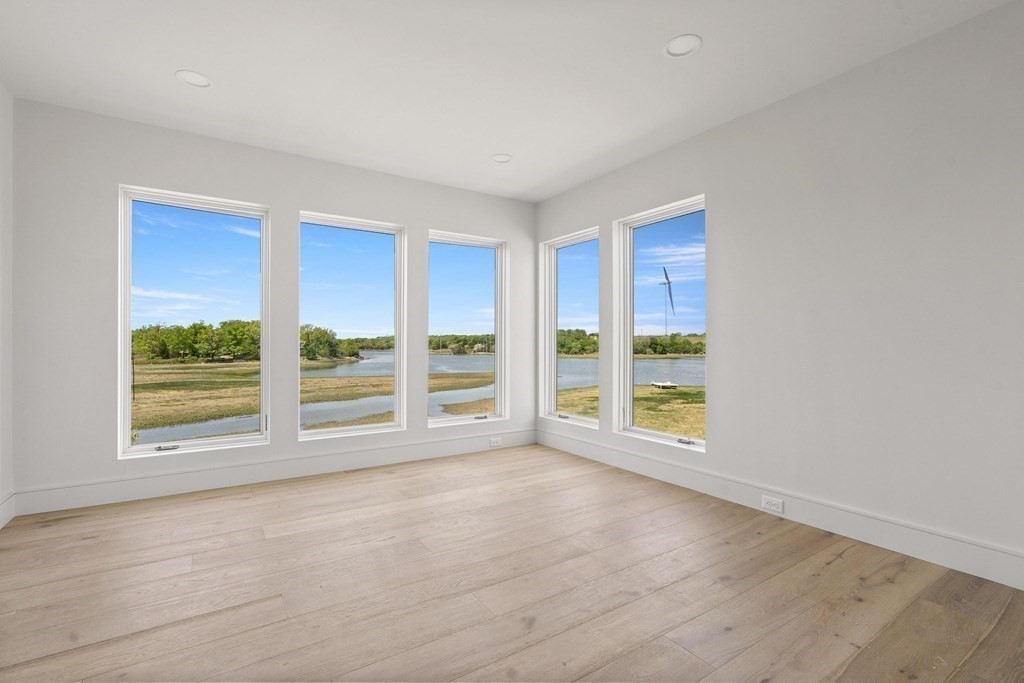 10 Chestnut Place Hingham, MA 02043 - Photo 24 of 41 a view of an empty room with wooden floor and a window