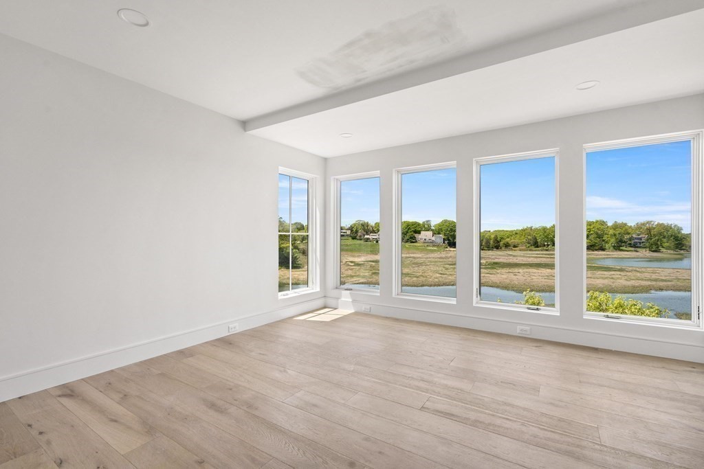 10 Chestnut Place Hingham, MA 02043 - Photo 27 of 41 wooden floor in an empty room with window