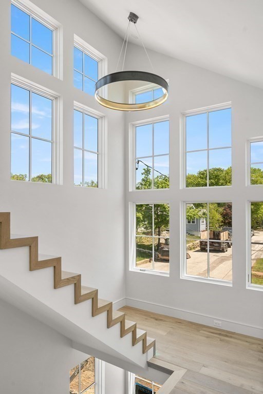 10 Chestnut Place Hingham, MA 02043 - Photo 29 of 41 a kitchen with stainless steel appliances a sink a stove and a window