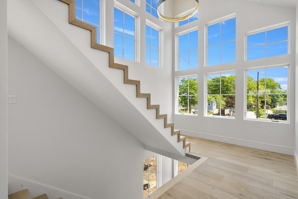 10 Chestnut Place Hingham, MA 02043 - Photo 30 of 41 a view of staircase with white walls and a window