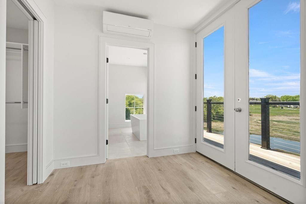 10 Chestnut Place Hingham, MA 02043 - Photo 32 of 41 wooden floor in an empty room with a window