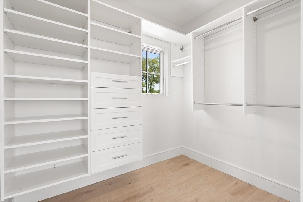 10 Chestnut Place Hingham, MA 02043 - Photo 33 of 41 a view of walk in closet with empty racks