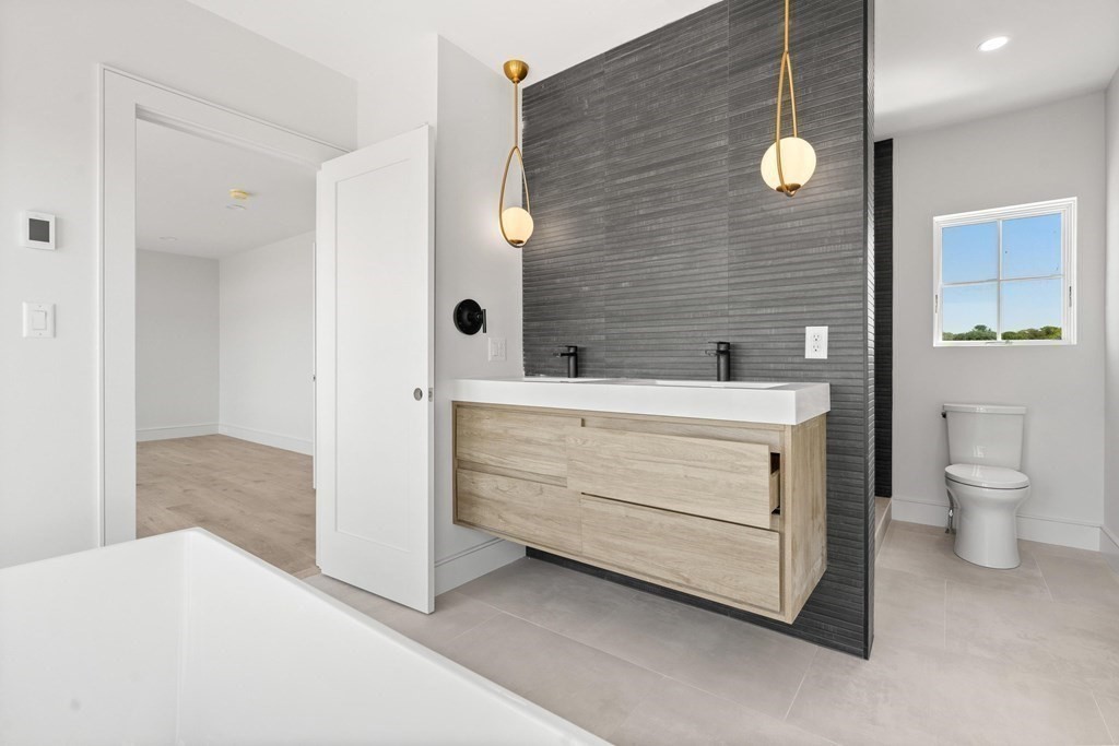 10 Chestnut Place Hingham, MA 02043 - Photo 35 of 41 a bathroom with a sink a toilet and shower