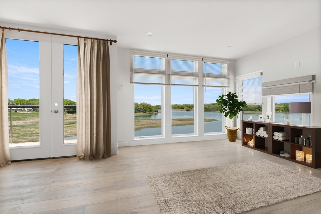 10 Chestnut Place Hingham, MA 02043 - Photo 7 of 41 an empty room with floor to ceiling window and an outdoor view