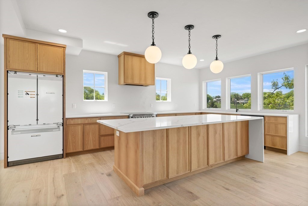 10 Chestnut Place Hingham, MA 02043 - Photo 9 of 41 a kitchen with a sink cabinets and window