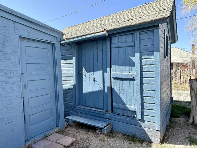 a wooden door in front of a house