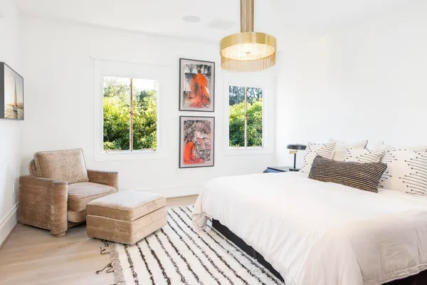 a bedroom with a bed and a couch
