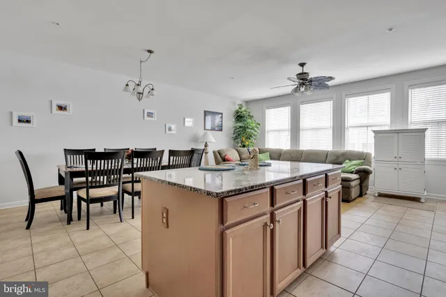 a kitchen with granite countertop a sink appliances and cabinets