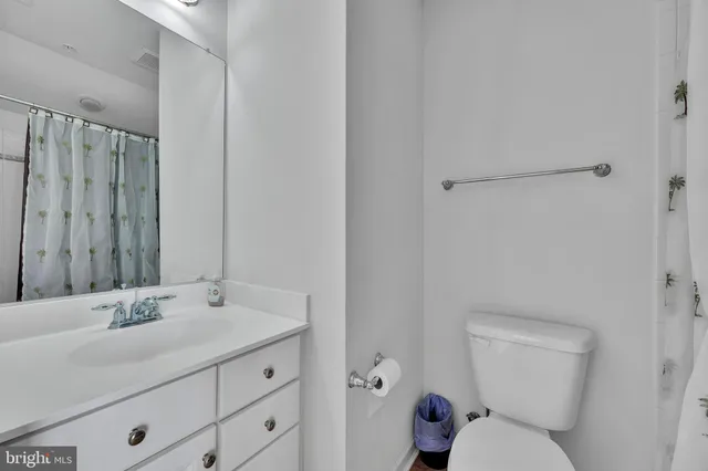 a bedroom with furniture and entryway