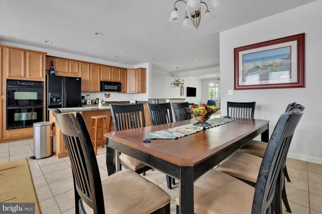 a view of dining room and kitchen with a table chairs a workspace