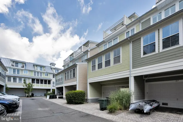 a view of balcony with wooden floor and outdoor seating