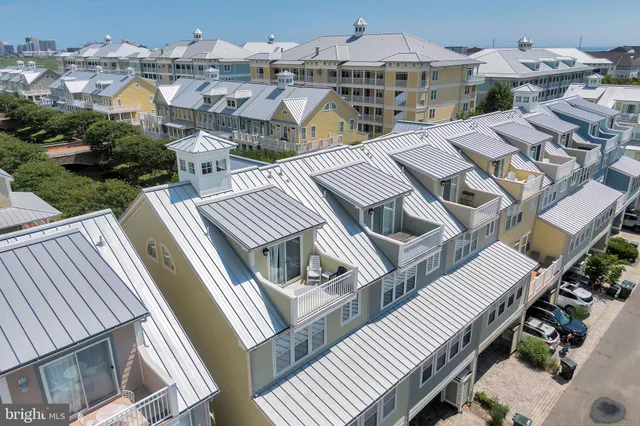 an aerial view of a house with a lake view