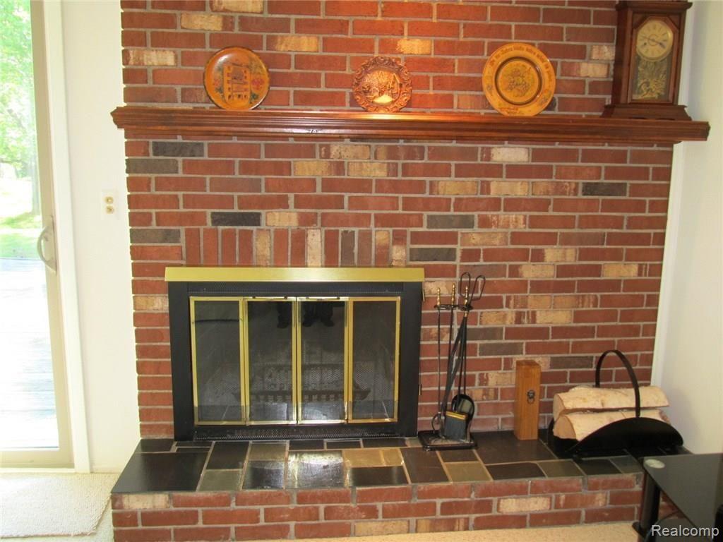 5260 Inverrary Lane Commerce Township, MI 48382 - Photo 8 of 24 Family Room Fireplace