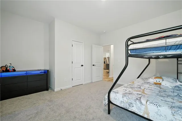 a bed room with a bed and a window