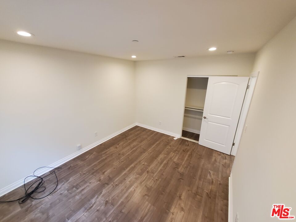 2227 Hauser Boulevard Los Angeles, CA 90016 - Photo 17 of 27 a view of empty room with wooden floor