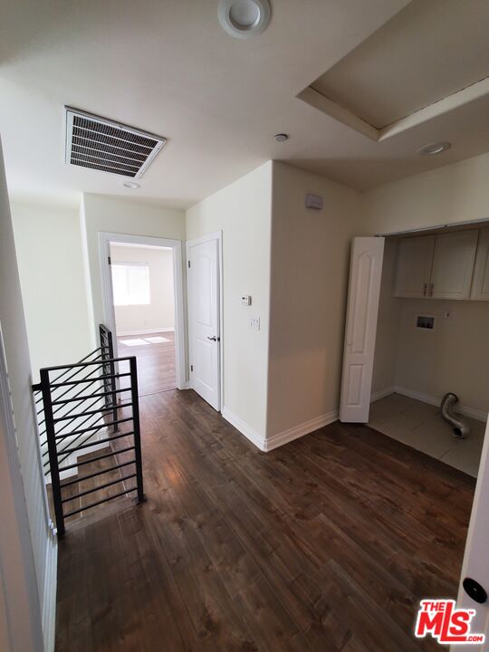 2227 Hauser Boulevard Los Angeles, CA 90016 - Photo 18 of 27 a view of a hallway with wooden floor and stairs