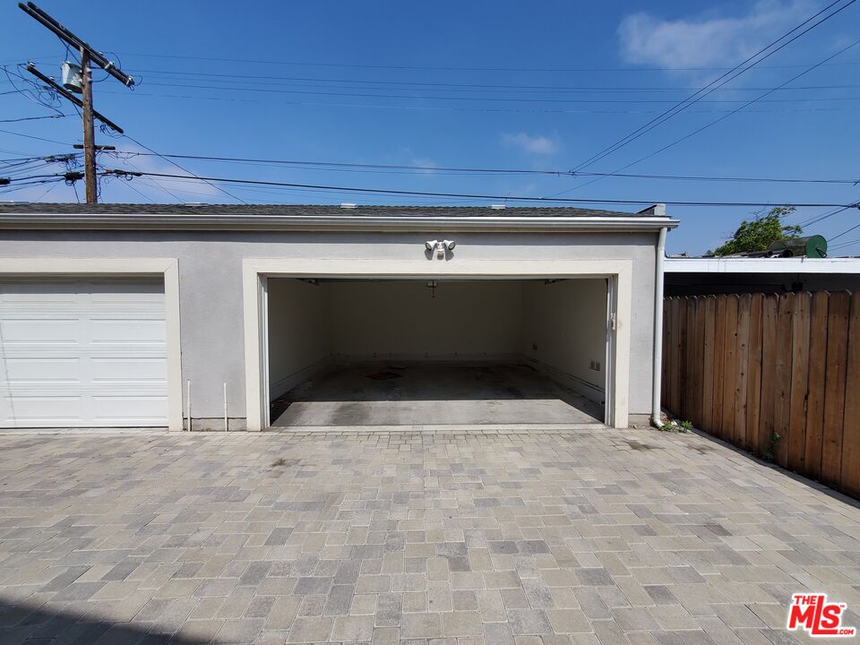 2227 Hauser Boulevard Los Angeles, CA 90016 - Photo 27 of 27 a view of an empty room with a fireplace