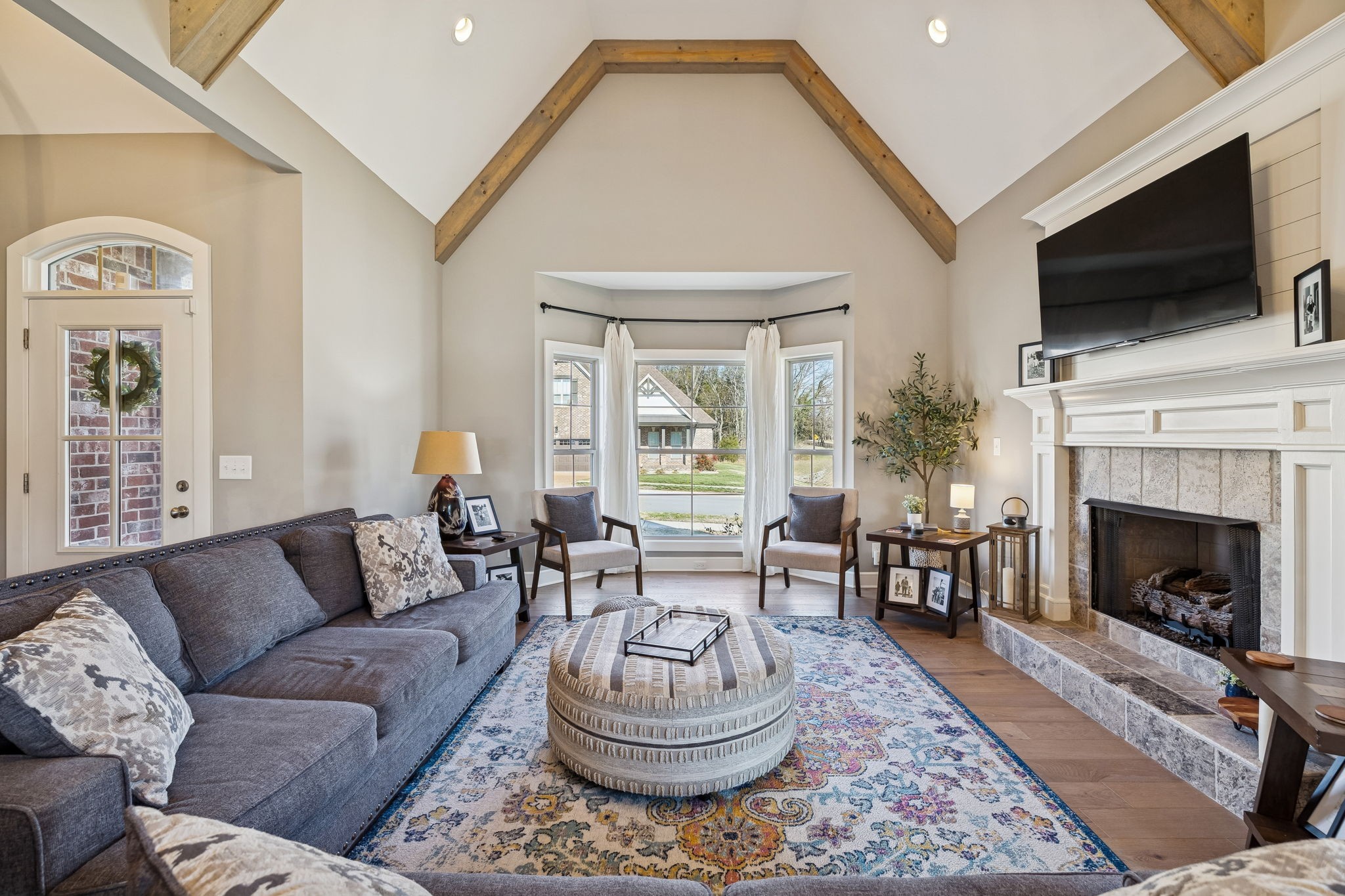 301 Timber Lane Lebanon, TN 37087 - Photo 11 of 74 a living room with furniture a flat screen tv and a fireplace