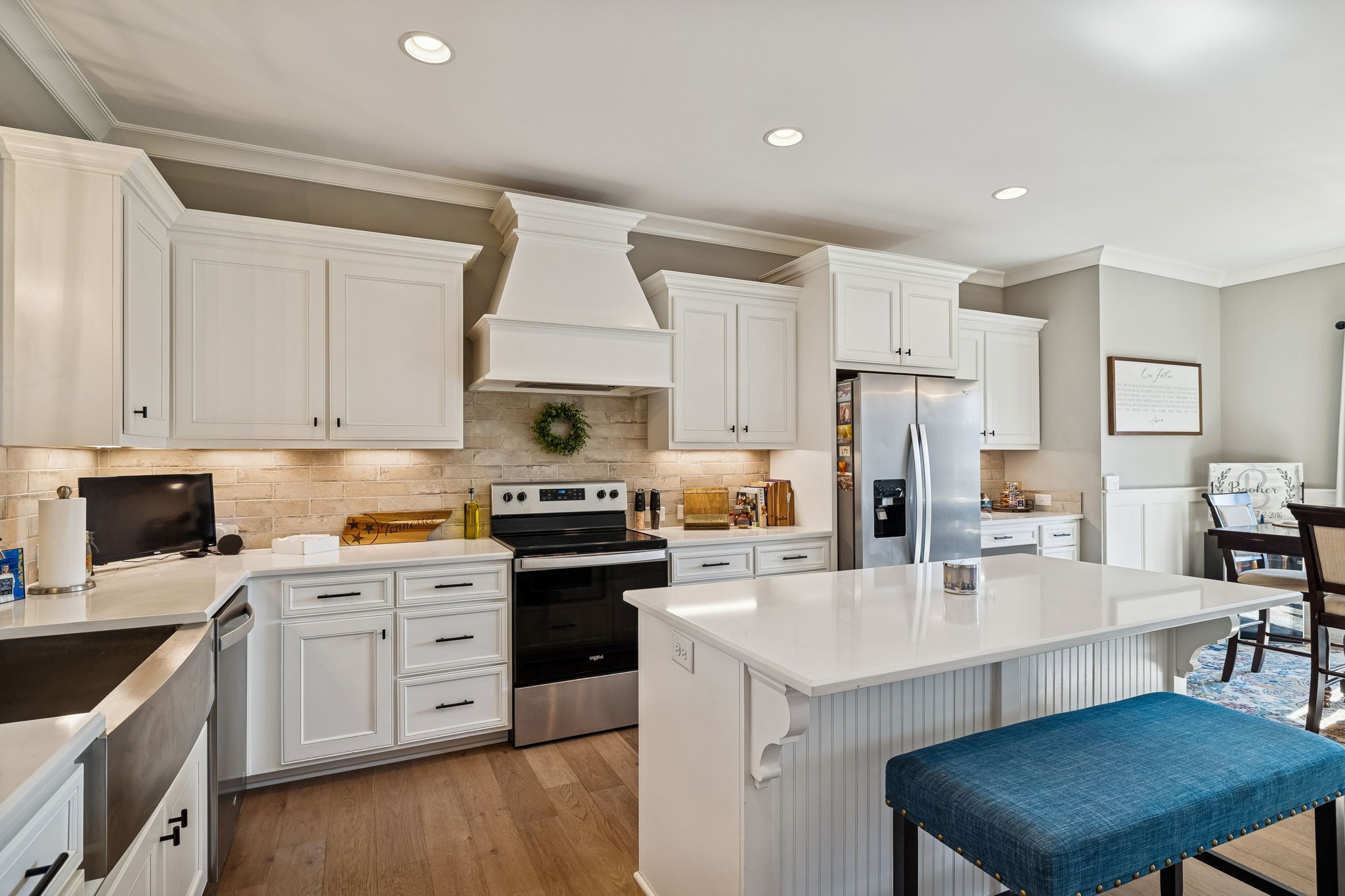 301 Timber Lane Lebanon, TN 37087 - Photo 23 of 74 a kitchen with a sink a stove a refrigerator and white cabinets