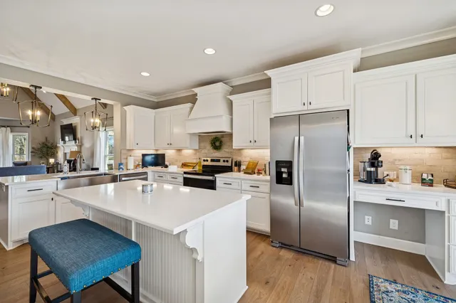 a bedroom with a bed and a large mirror