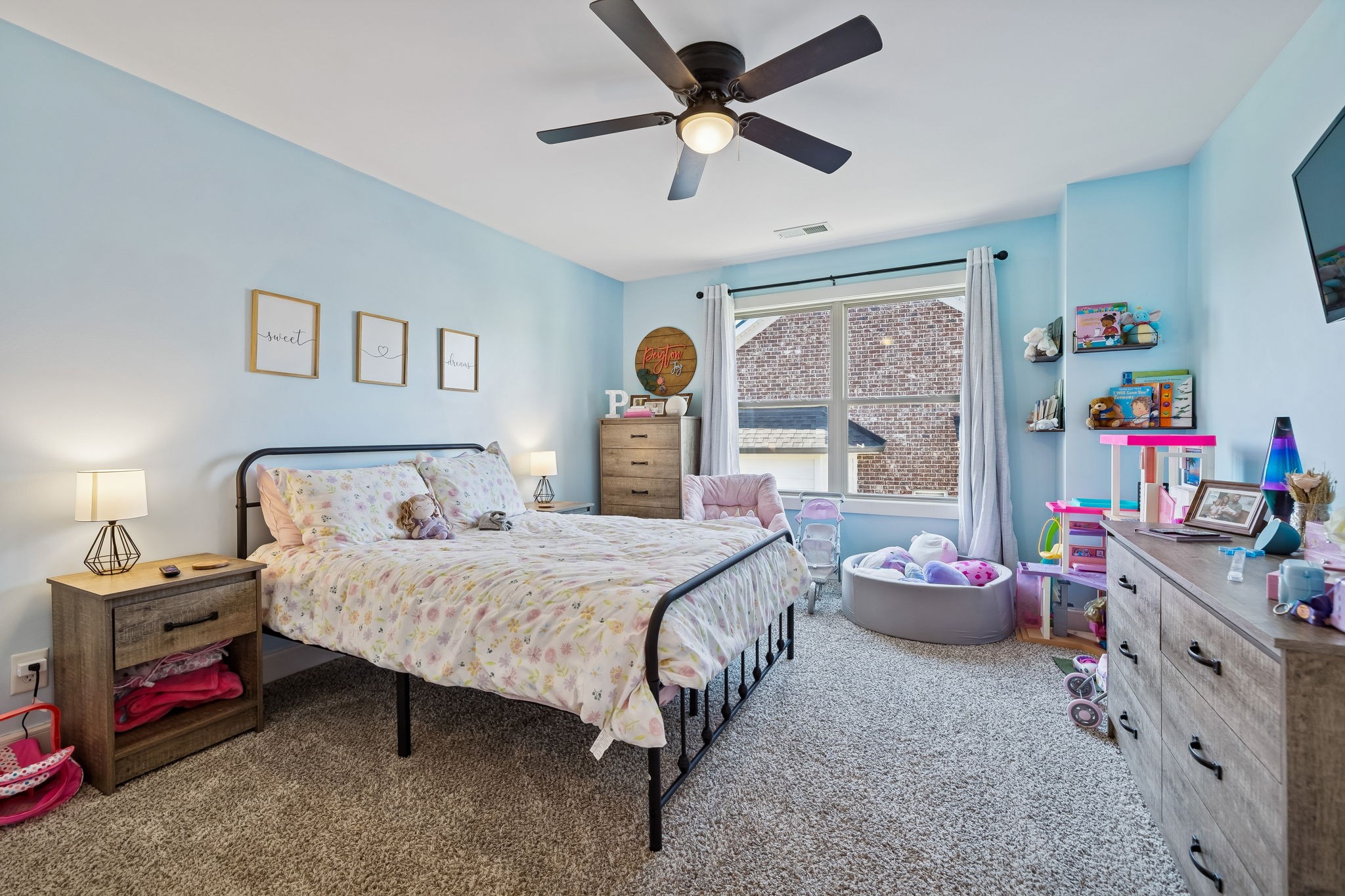 301 Timber Lane Lebanon, TN 37087 - Photo 45 of 74 a bedroom with a bed and a chandelier