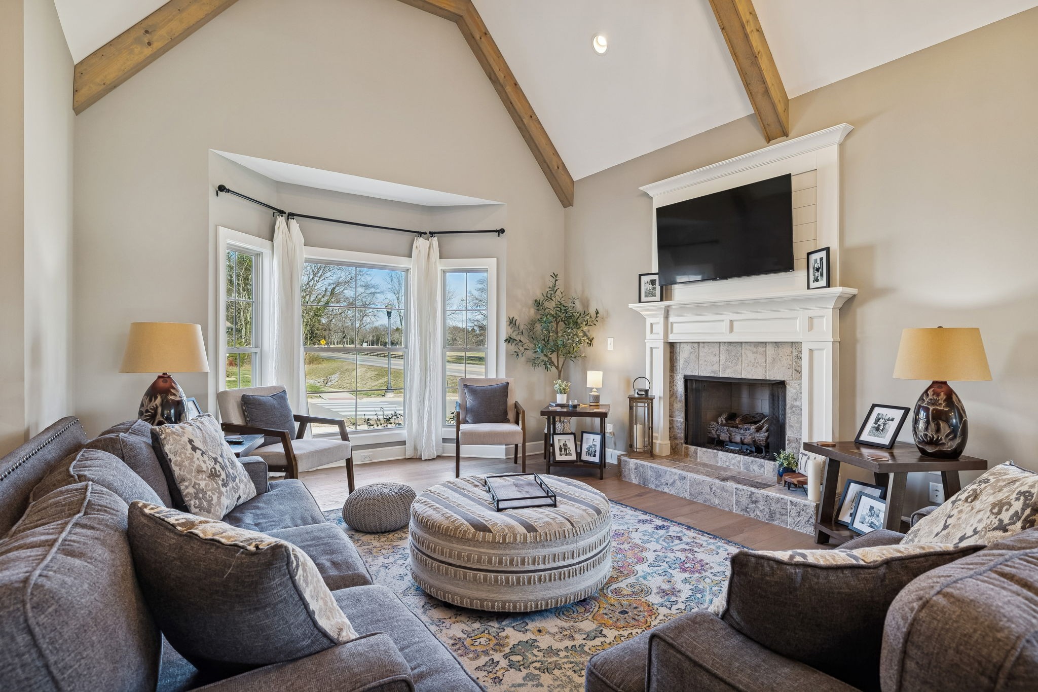 301 Timber Lane Lebanon, TN 37087 - Photo 9 of 74 a living room with furniture a flat screen tv and a fireplace