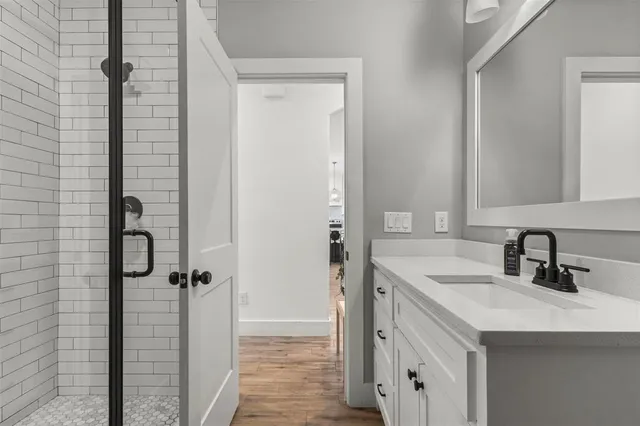 a bathroom with a sink and a mirror