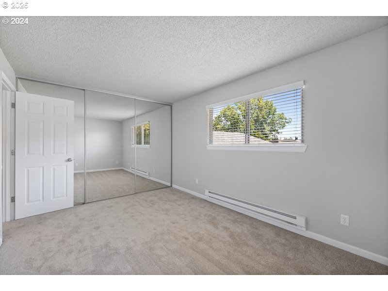 2921 Northeast Rene Avenue, Unit 15B Gresham, OR 97030 - Photo 13 of 22 a view of an empty room with a window