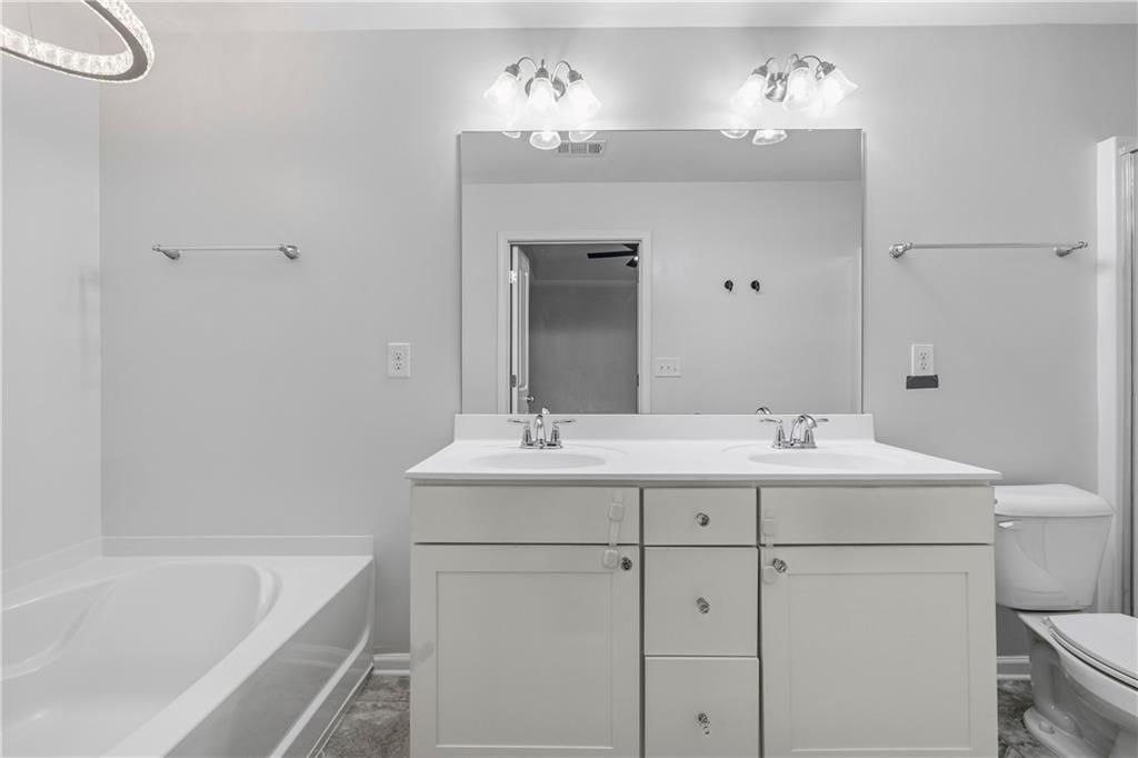 5038 Longview Walk Decatur, GA 30035 - Photo 17 of 25 a bathroom with a sink and a bathtub