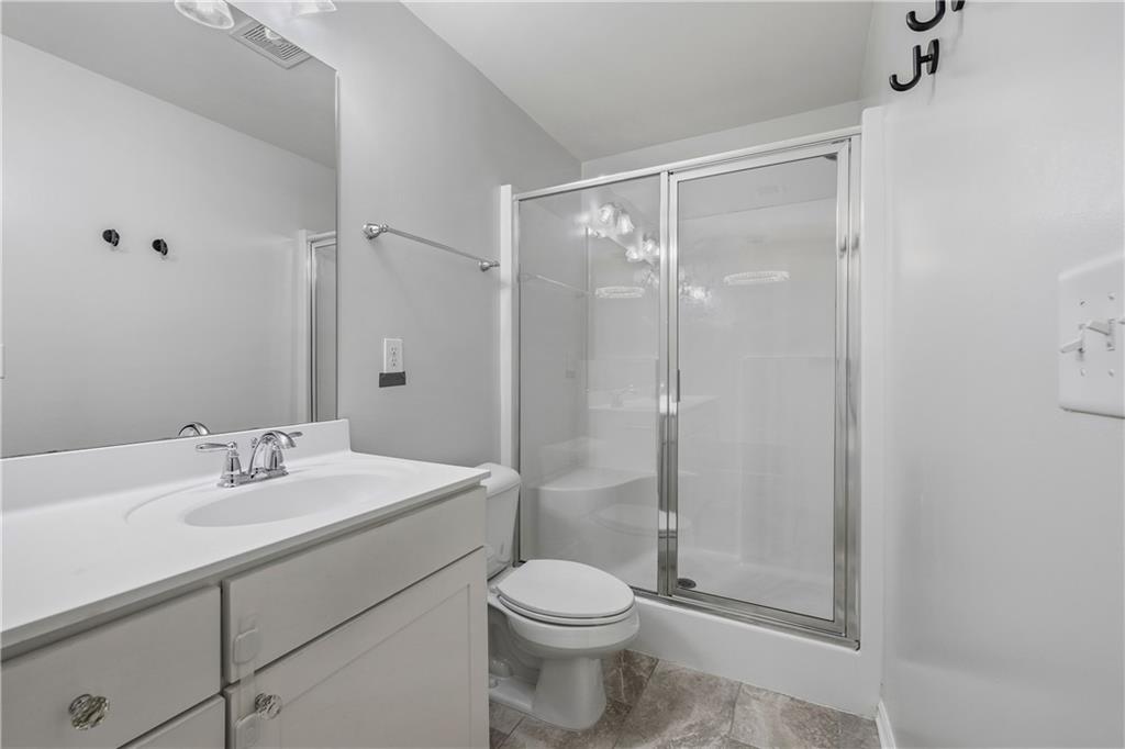 5038 Longview Walk Decatur, GA 30035 - Photo 18 of 25 a bathroom with a sink toilet and shower