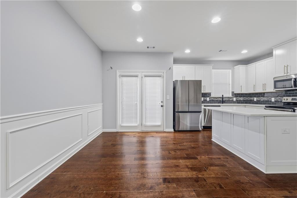 5038 Longview Walk Decatur, GA 30035 - Photo 6 of 25 a kitchen with a refrigerator and a stove top oven