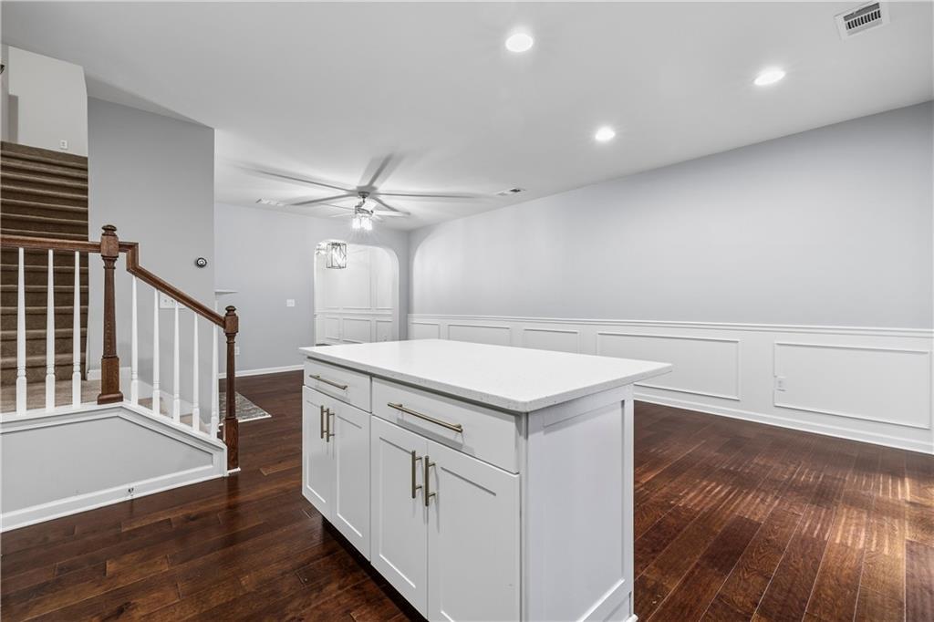5038 Longview Walk Decatur, GA 30035 - Photo 10 of 25 a kitchen with a stove and a wooden floor