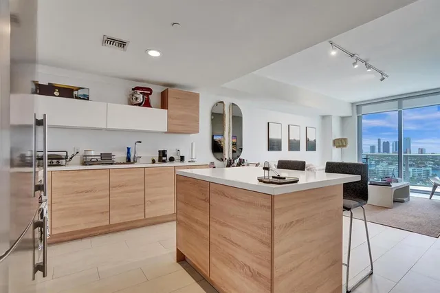 a kitchen with stainless steel appliances granite countertop a sink and cabinets