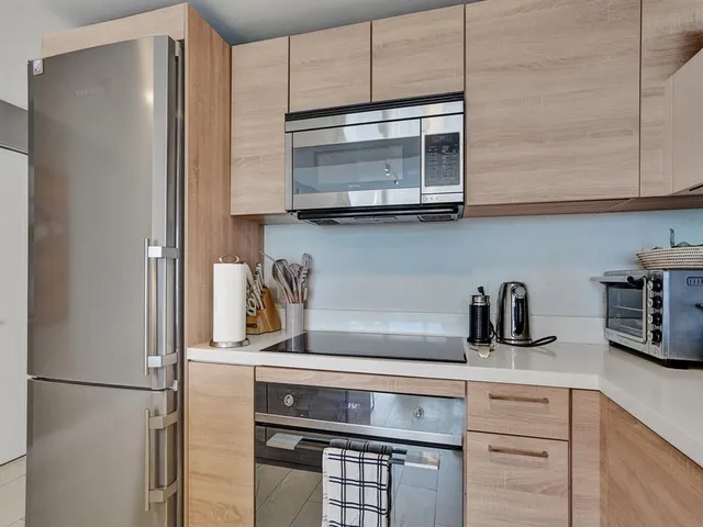 a kitchen with appliances and cabinets