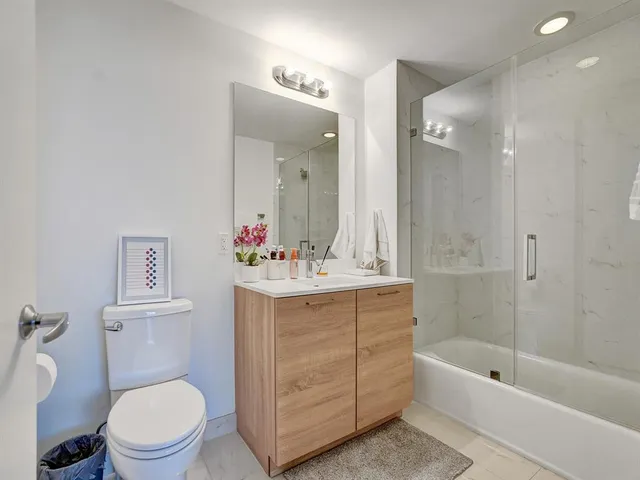 a bathroom with a sink a toilet and a bathtub